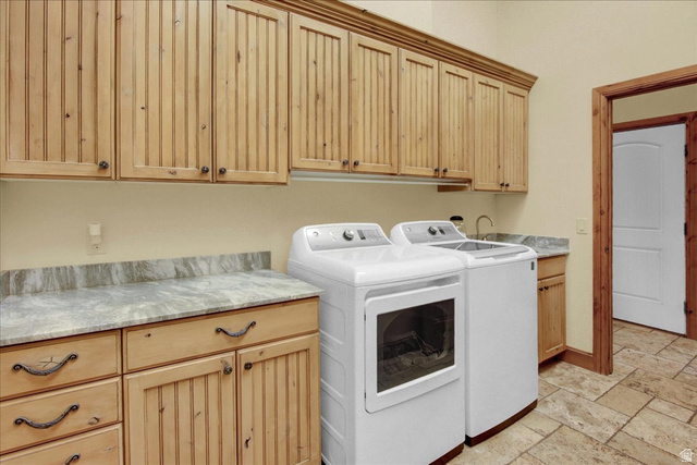 667 Hardscrabble Road Morgan, UT 84050 - Photo 20 of 51 Laundry area featuring stone tile floors, cabinet space, and washer and dryer