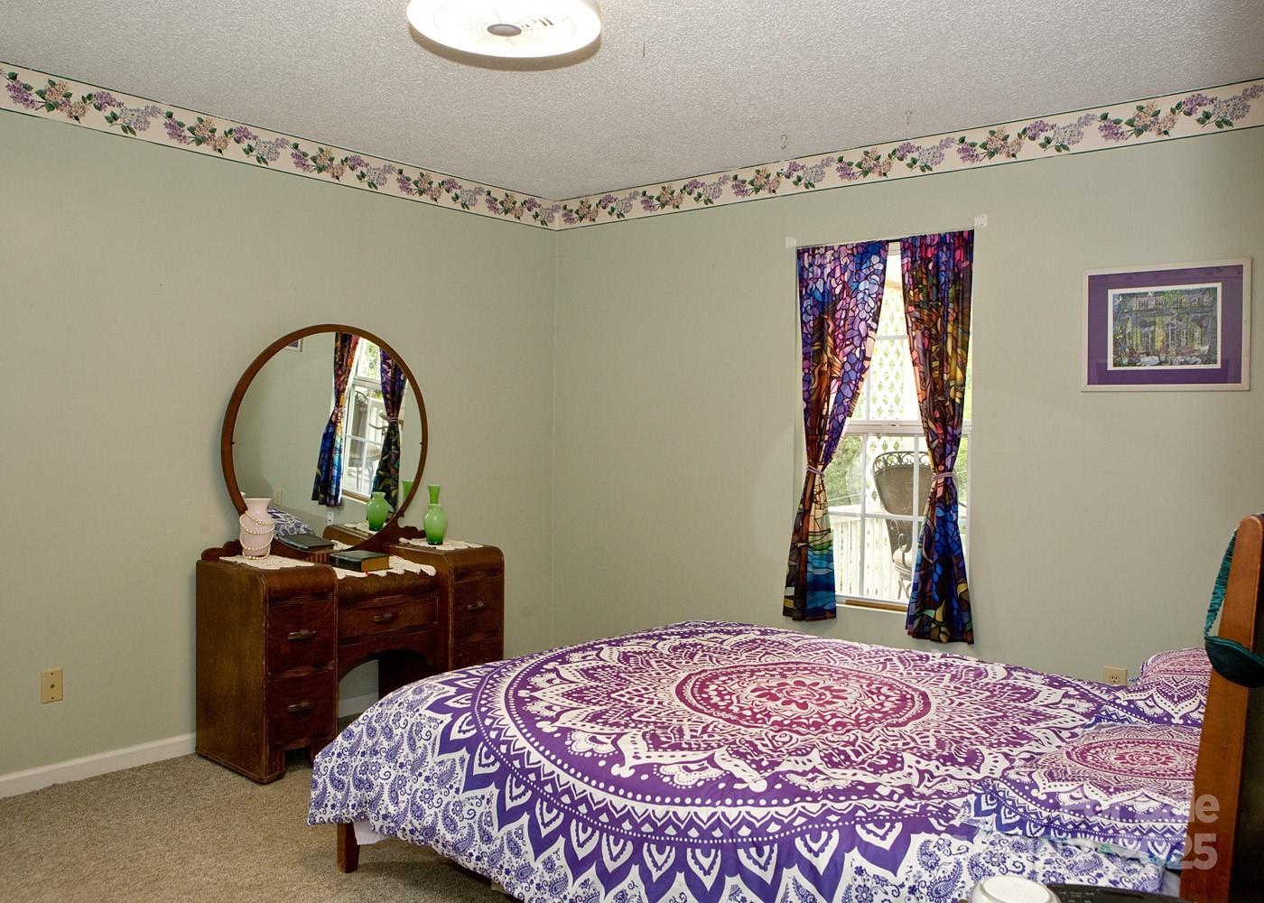 165 Peepeye Cove Road Leicester, NC 28748 - Photo 13 of 24 a bedroom with a bed and a dresser