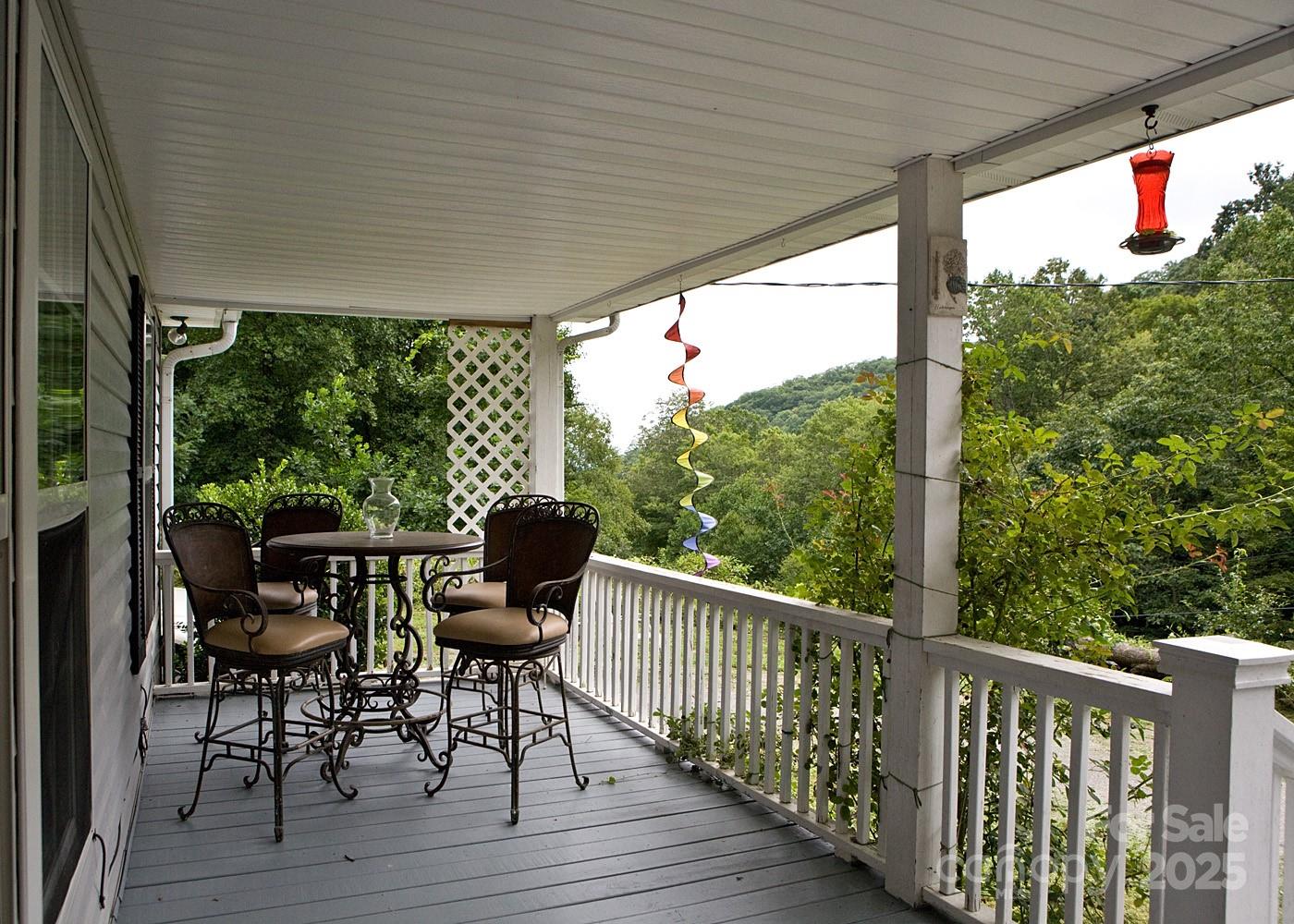 165 Peepeye Cove Road Leicester, NC 28748 - Photo 18 of 24 a view of a chair and table in the balcony