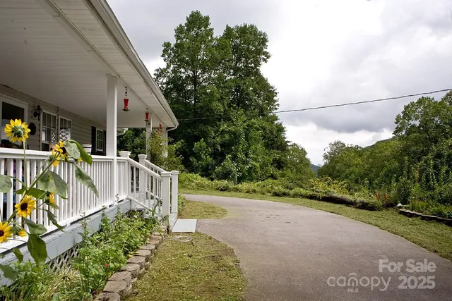 a view of a pathway with a wrought fence