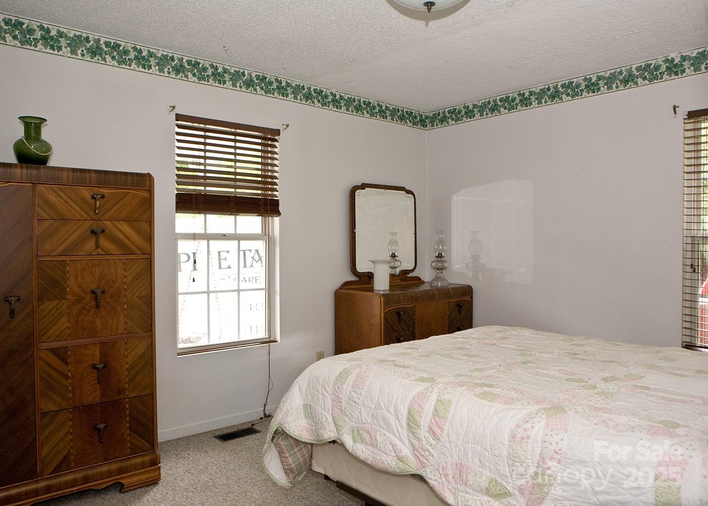 165 Peepeye Cove Road Leicester, NC 28748 - Photo 6 of 24 a bedroom with a bed and a window