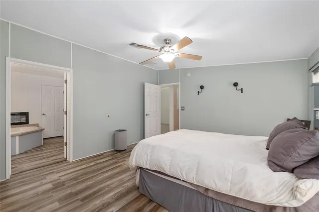 a bedroom with a large bed and a window