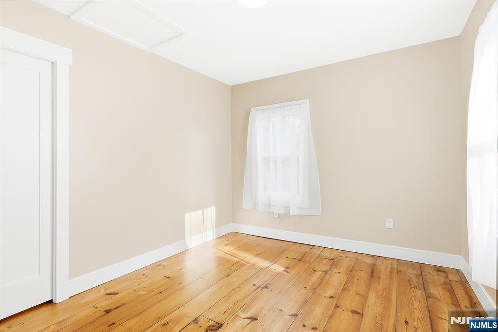 36 Pascack Road, Unit 2 Park Ridge, NJ 07656 - Photo 8 of 22 a view of an empty room and wooden floor