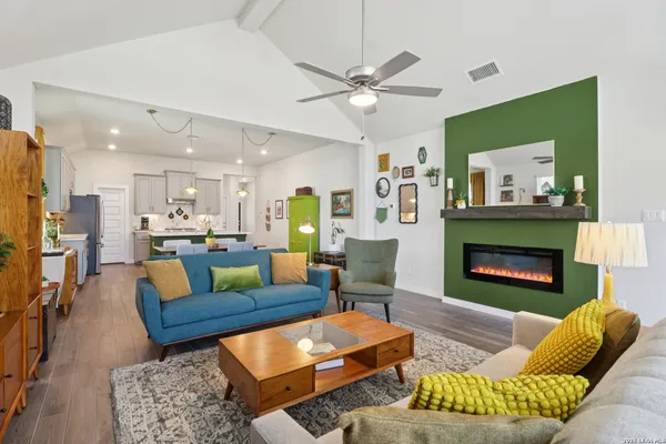 a living room with furniture and a fireplace