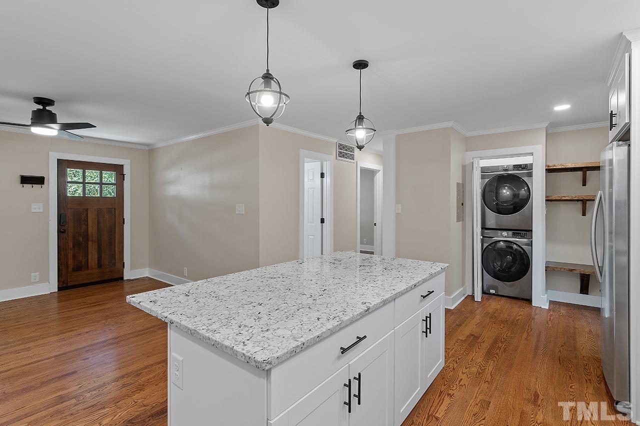 2609 Elmhurst Circle Raleigh, NC 27610 - Photo 12 of 34 a kitchen with stainless steel appliances granite countertop a sink a refrigerator and a stove