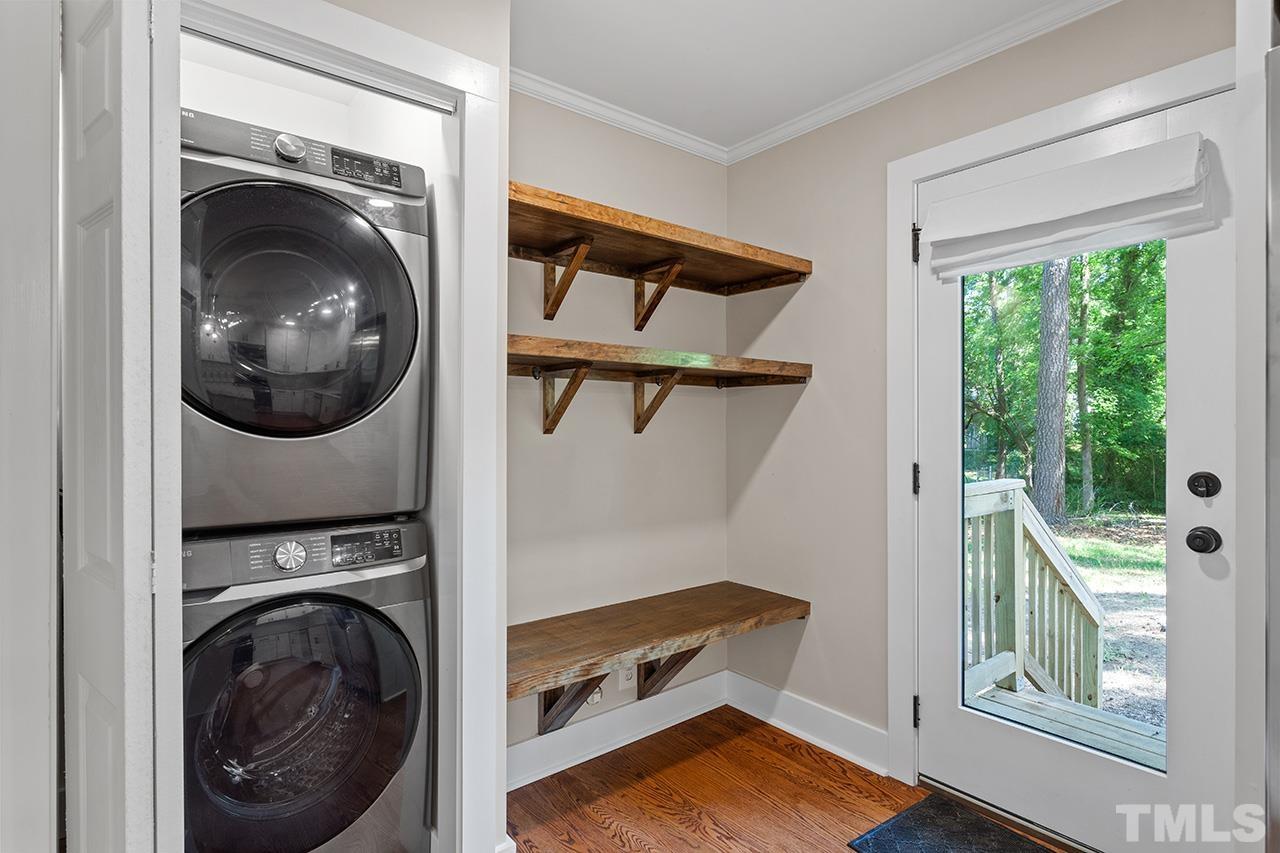 2609 Elmhurst Circle Raleigh, NC 27610 - Photo 16 of 34 a view of a bedroom with washer and dryer
