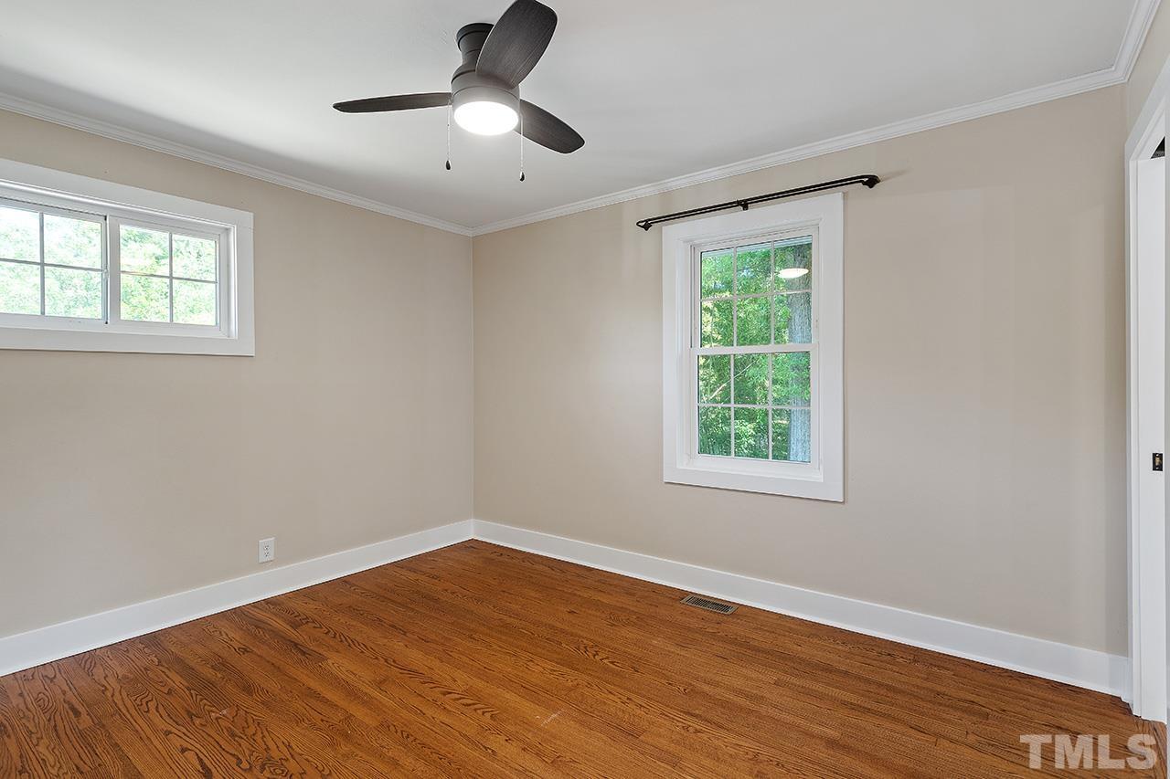2609 Elmhurst Circle Raleigh, NC 27610 - Photo 17 of 34 a view of empty room with wooden floor and fan
