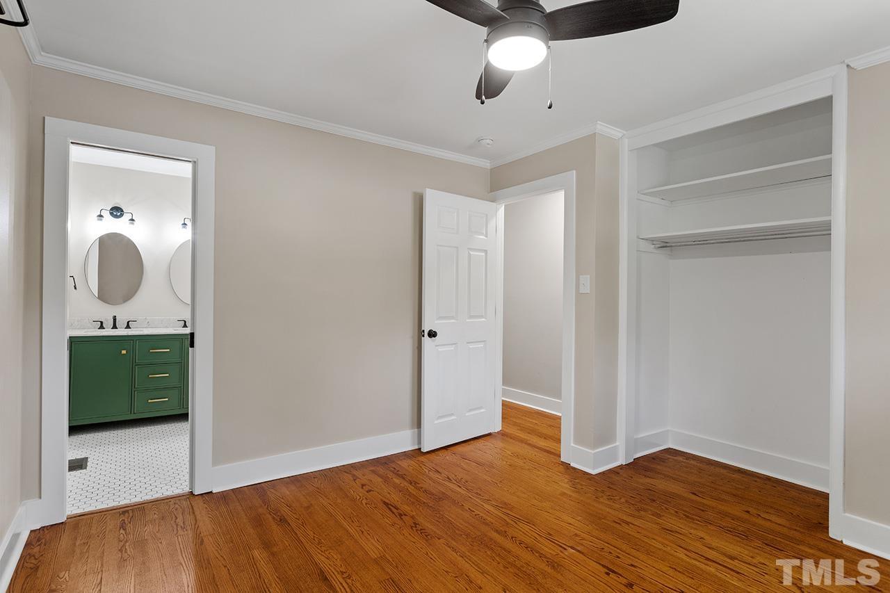 2609 Elmhurst Circle Raleigh, NC 27610 - Photo 18 of 34 a view of a room with wooden floor and mirror