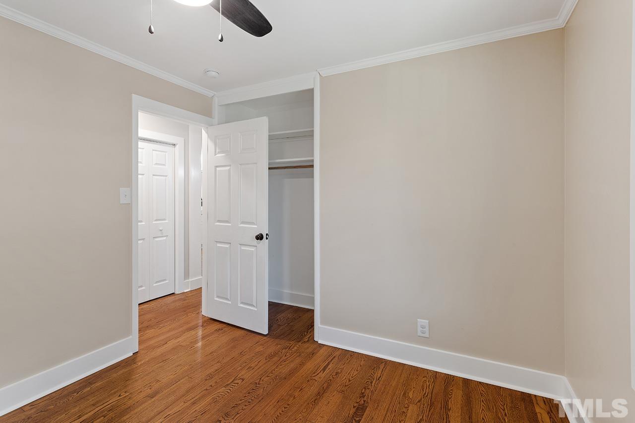 2609 Elmhurst Circle Raleigh, NC 27610 - Photo 23 of 34 a view of an empty room with wooden floor
