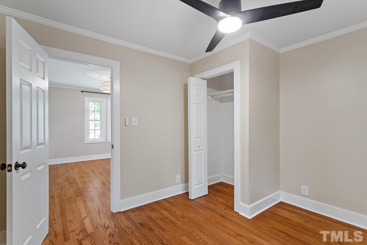 2609 Elmhurst Circle Raleigh, NC 27610 - Photo 29 of 34 an empty room with wooden floor and windows