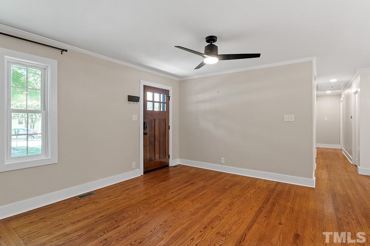2609 Elmhurst Circle Raleigh, NC 27610 - Photo 3 of 34 wooden floor in an empty room with a window