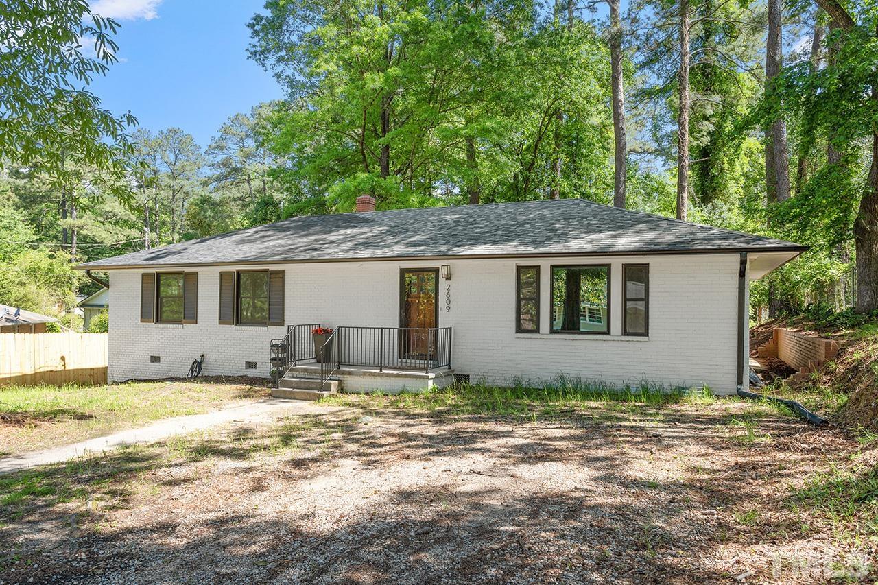 2609 Elmhurst Circle Raleigh, NC 27610 - Photo 34 of 34 a house that has a tree in front of it