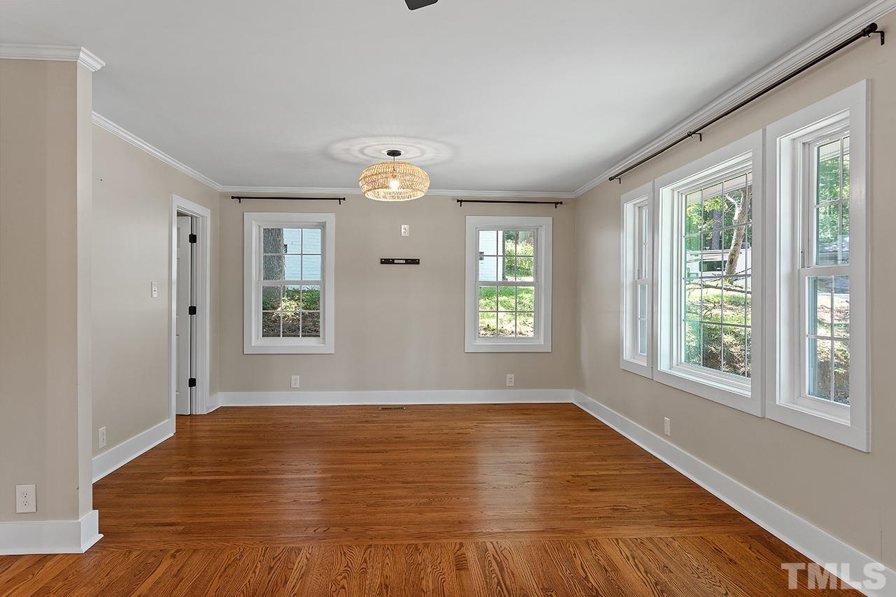 2609 Elmhurst Circle Raleigh, NC 27610 - Photo 6 of 34 a view of empty room with wooden floor and fan