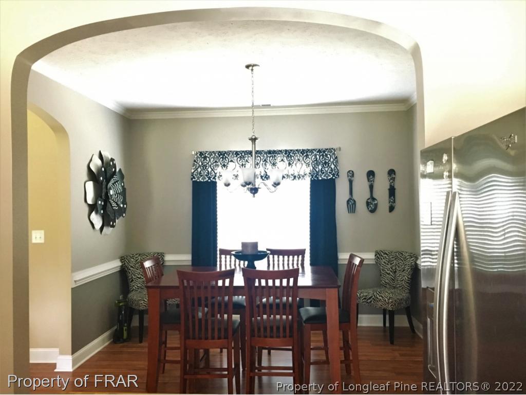 804 Raspberry Road Stedman, NC 28391 - Photo 11 of 34 a view of a dining room with furniture window and outside view