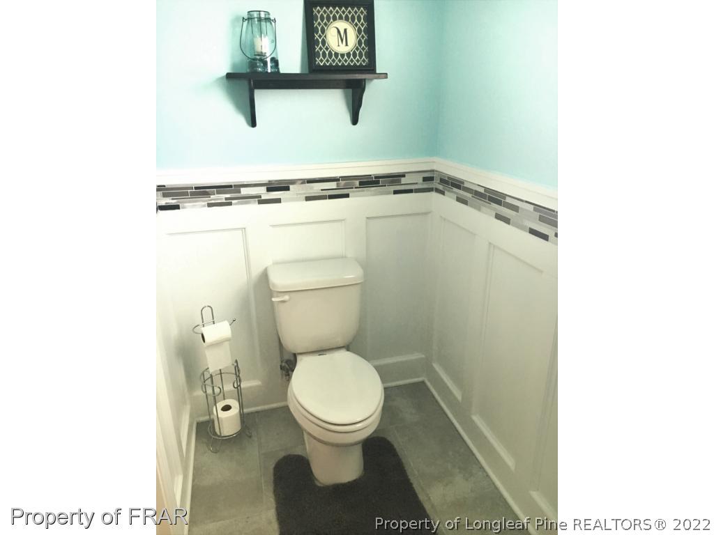 804 Raspberry Road Stedman, NC 28391 - Photo 15 of 34 a bathroom with a toilet and a vanity