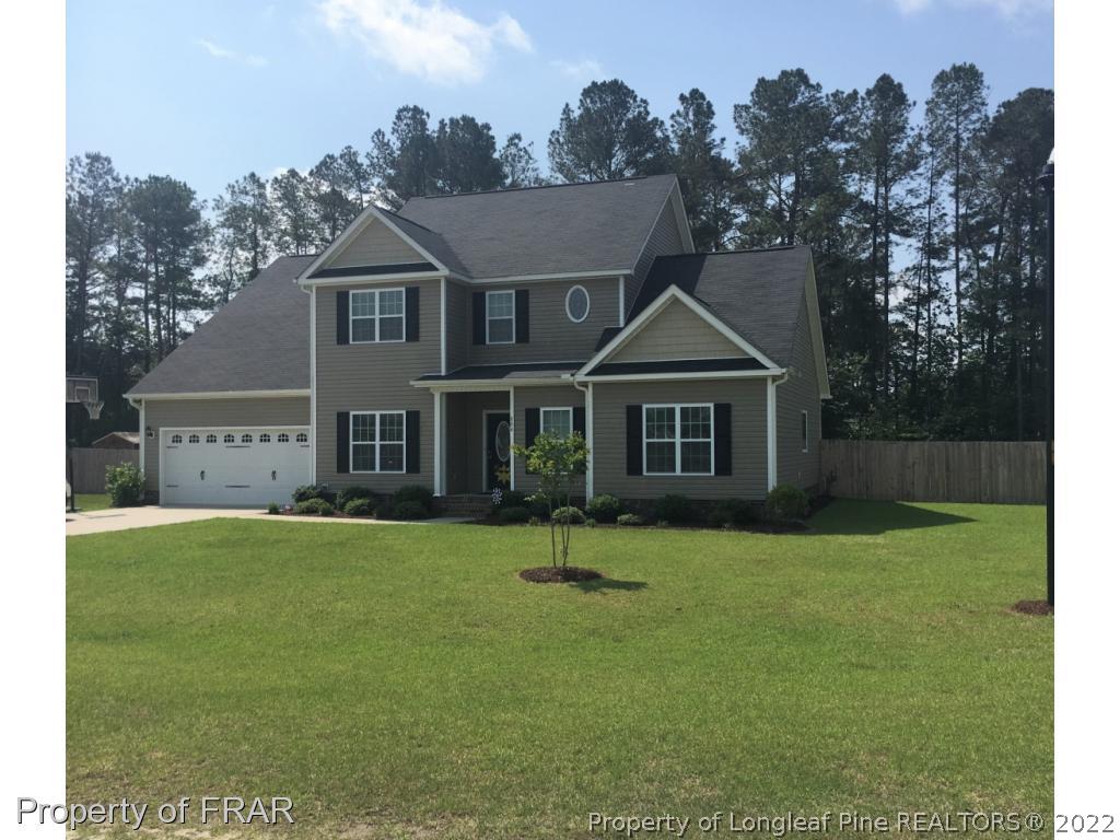 804 Raspberry Road Stedman, NC 28391 - Photo 2 of 34 a front view of a house with a yard