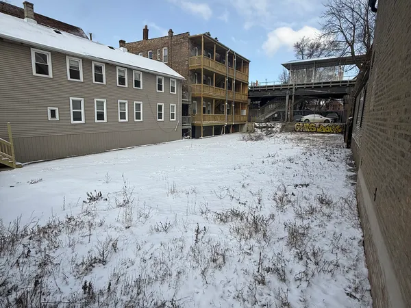 a front view of residential houses with yard
