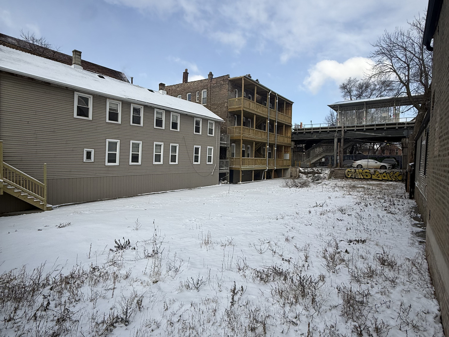 2050 West 21st Street Chicago, IL 60608 - Photo 7 of 7 a view of a building with a yard covered with snow in the yard