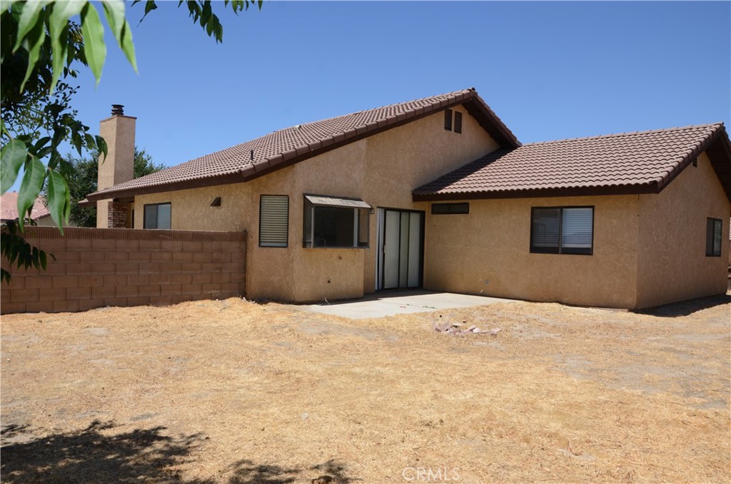 43600 Santa Rosa Circle Lancaster, CA 93535 - Photo 14 of 25 a front view of a house with a yard covered in snow