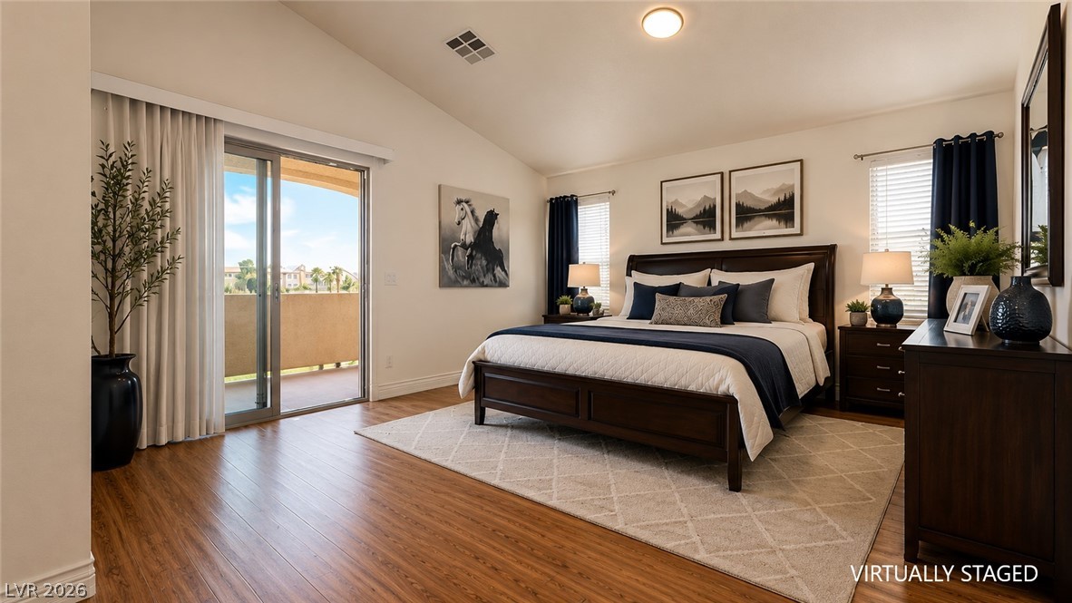 87 Tall Ruff Drive Las Vegas, NV 89148 - Photo 58 of 71 Elegant primary suite with private balcony access and warm wood flooring.