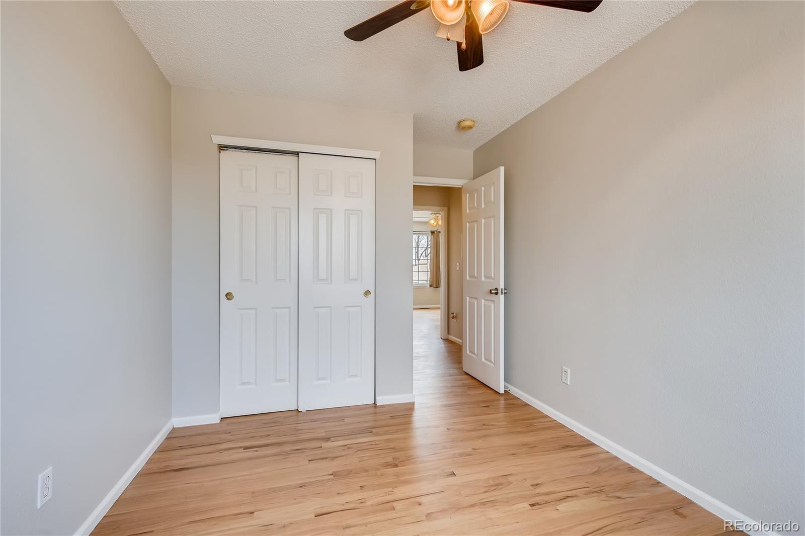 9684 South Castle Ridge Circle Highlands Ranch, CO 80129 - Photo 20 of 28 wooden floor in an empty room