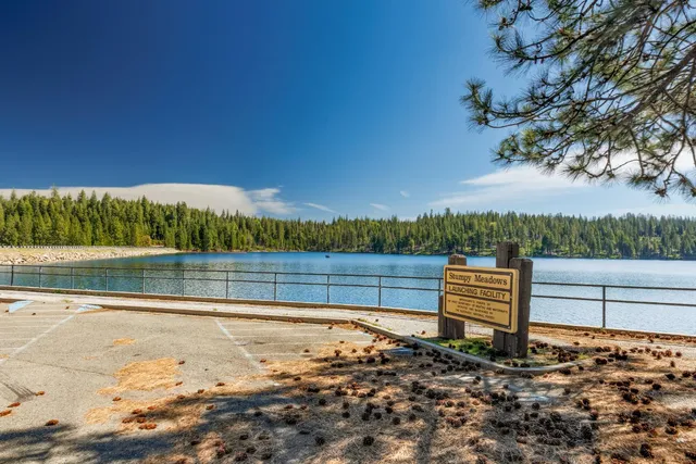 a view of lake with a yard