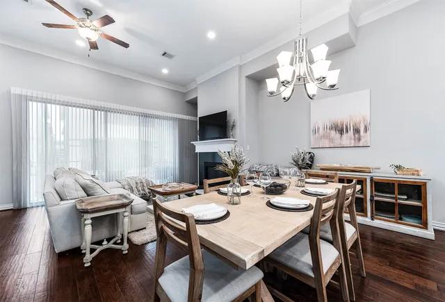 a living room with fireplace furniture and a flat screen tv