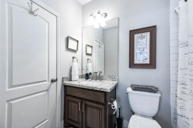 a bedroom with furniture and a large window