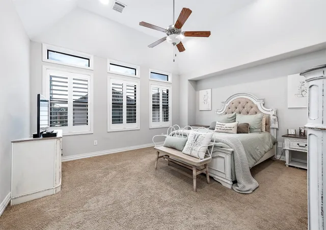 a bedroom with furniture and a bed