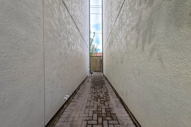 a backyard of a house with outdoor seating