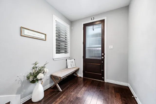a workspace with furniture window and wooden floor