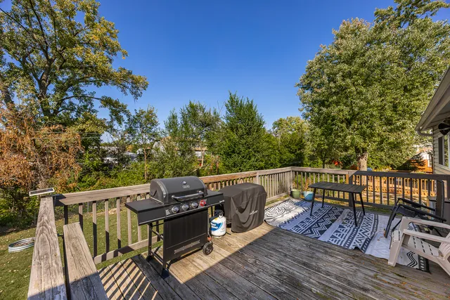 a view of balcony with wooden floor and outdoor seating