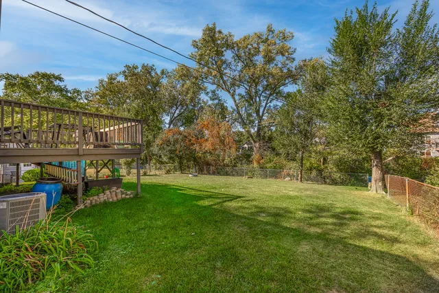 a view of a chairs and table in the garden