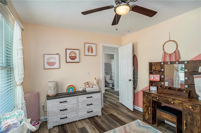 a bed room with a bed and a television