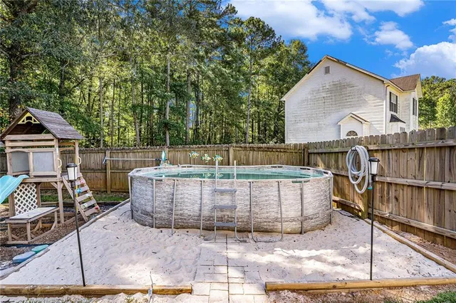 a view of a house with a back yard