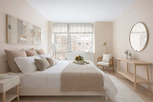 a kitchen with stainless steel appliances granite countertop a refrigerator a sink dishwasher a dining table and chairs with wooden floor