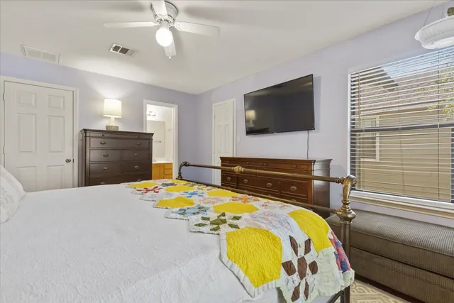 a bedroom with a bed and dresser