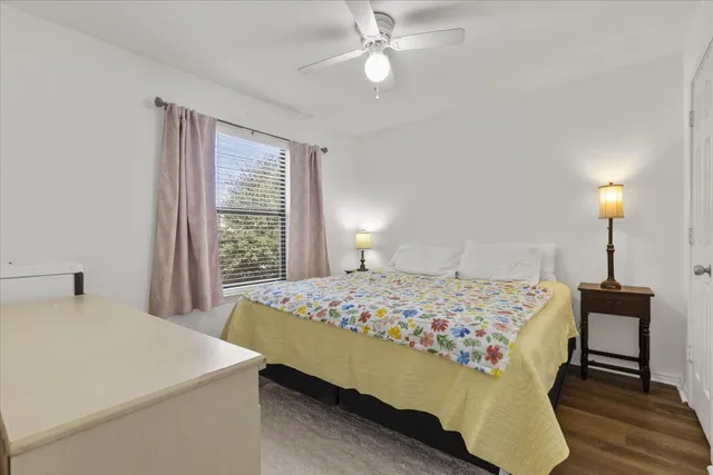 a bedroom with a bed and a table