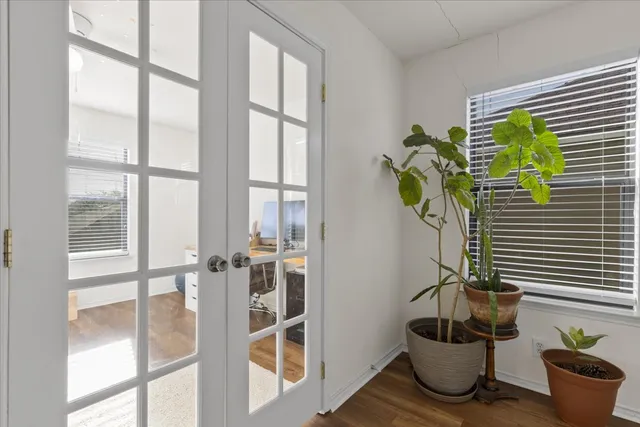 a vase of flowers sitting next to a window