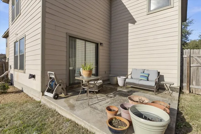 a view of a patio with chairs and tables