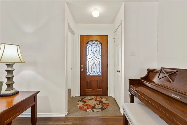 a bedroom with a bed and a lamp on table
