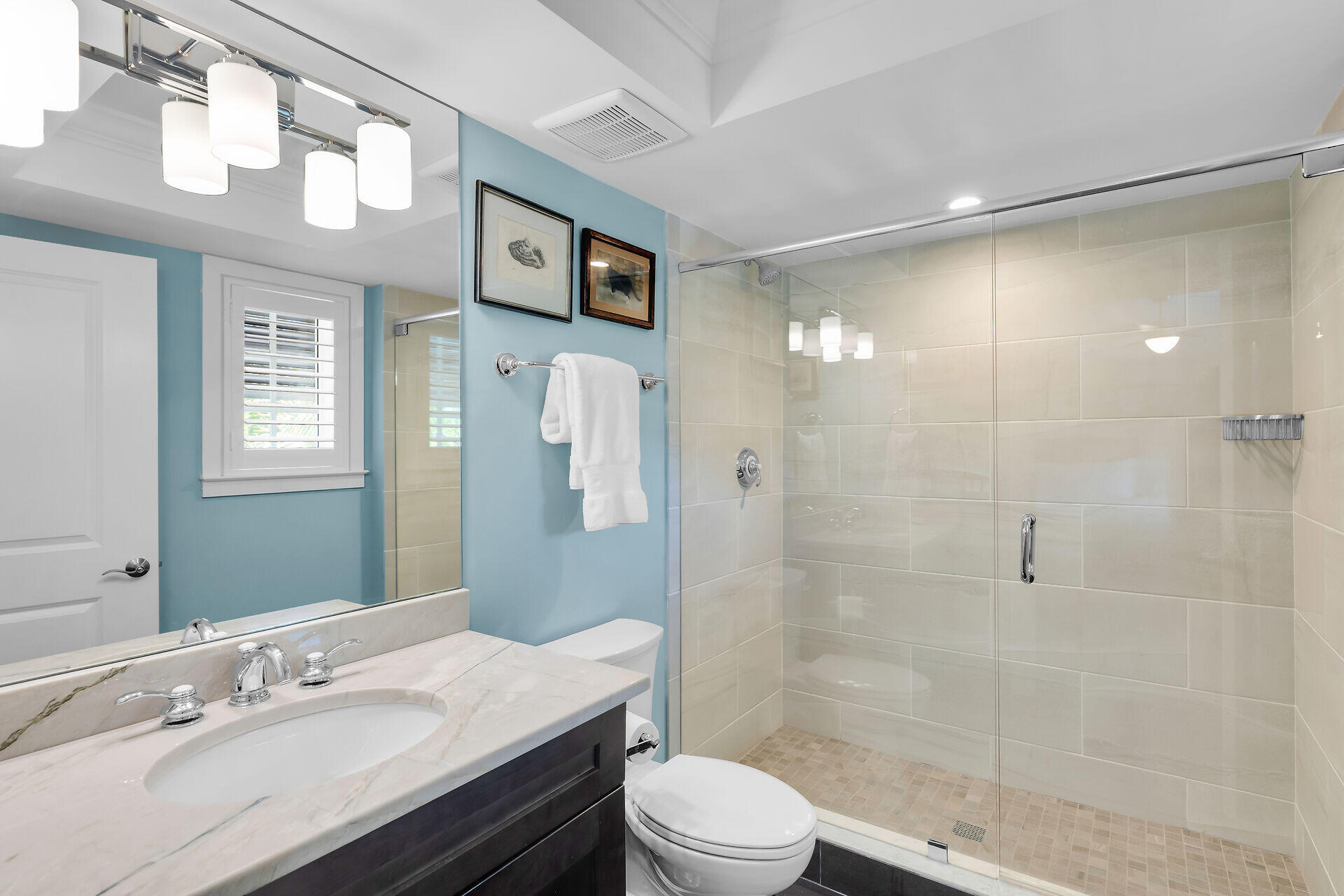 141 Simonton Street Key West, FL 33040 - Photo 22 of 49 a bathroom with a sink a toilet a mirror and shower