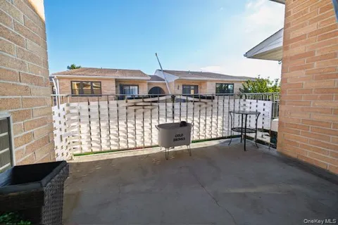 a view of a brick house with many windows