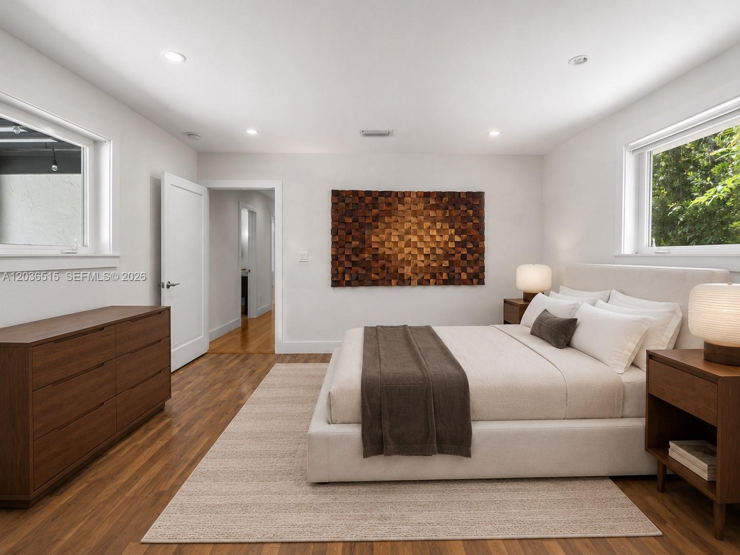 7711 Erwin Road Coral Gables, FL 33143 - Photo 16 of 26 a bedroom with a large bed and a window