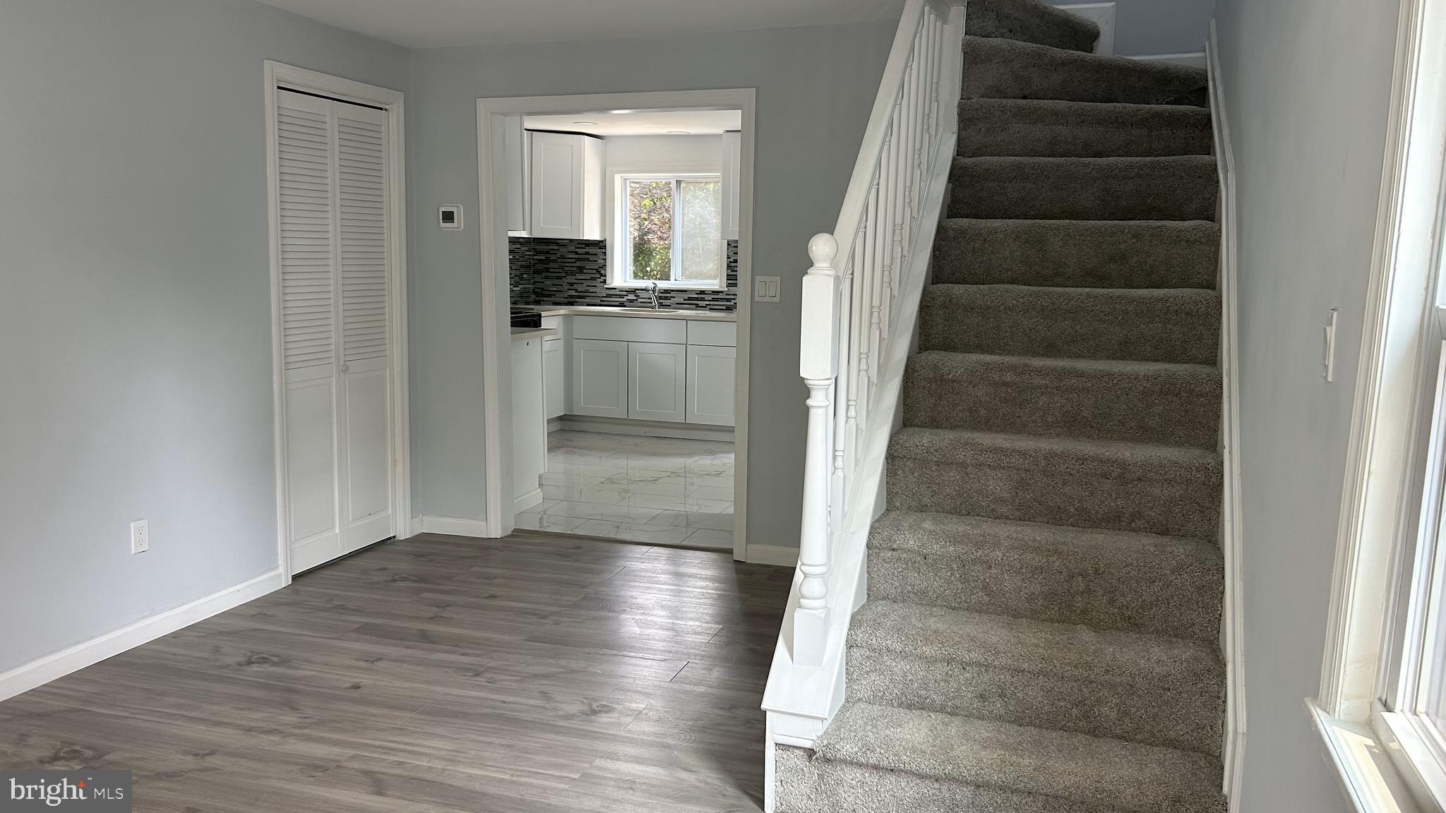69 Carpenter Street Salem, NJ 08079 - Photo 14 of 29 a view of an entryway with wooden floor and staircase