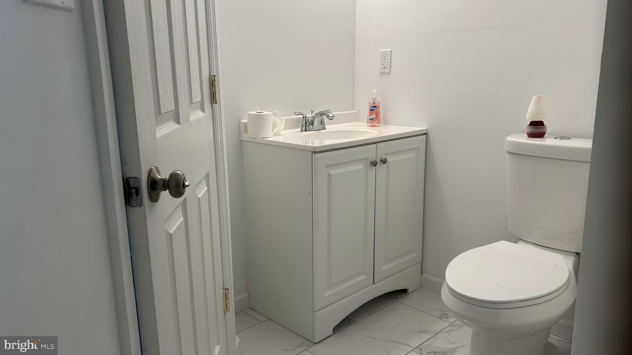 69 Carpenter Street Salem, NJ 08079 - Photo 23 of 29 a bathroom with a sink a toilet and shower