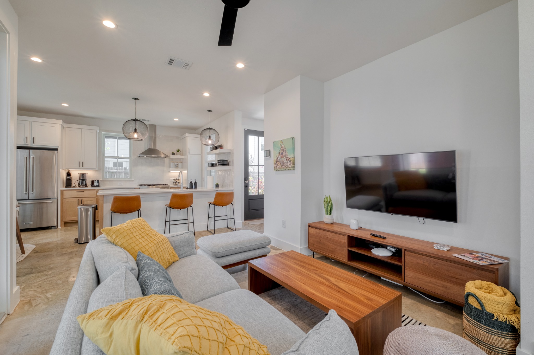 5406 Downs Drive, Unit 2 Austin, TX 78721 - Photo 11 of 24 a living room with furniture and a flat screen tv
