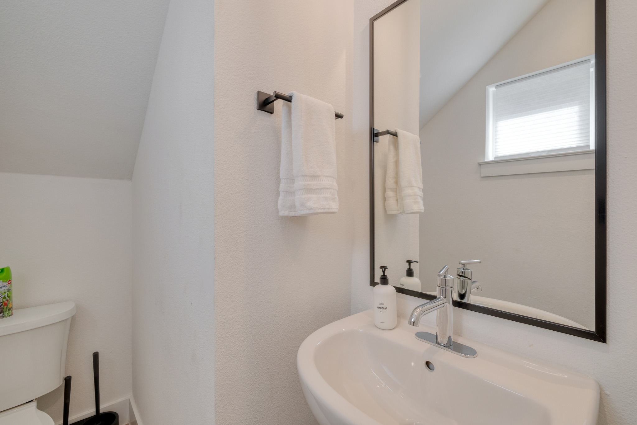 5406 Downs Drive, Unit 2 Austin, TX 78721 - Photo 13 of 24 a bathroom with a sink and a mirror