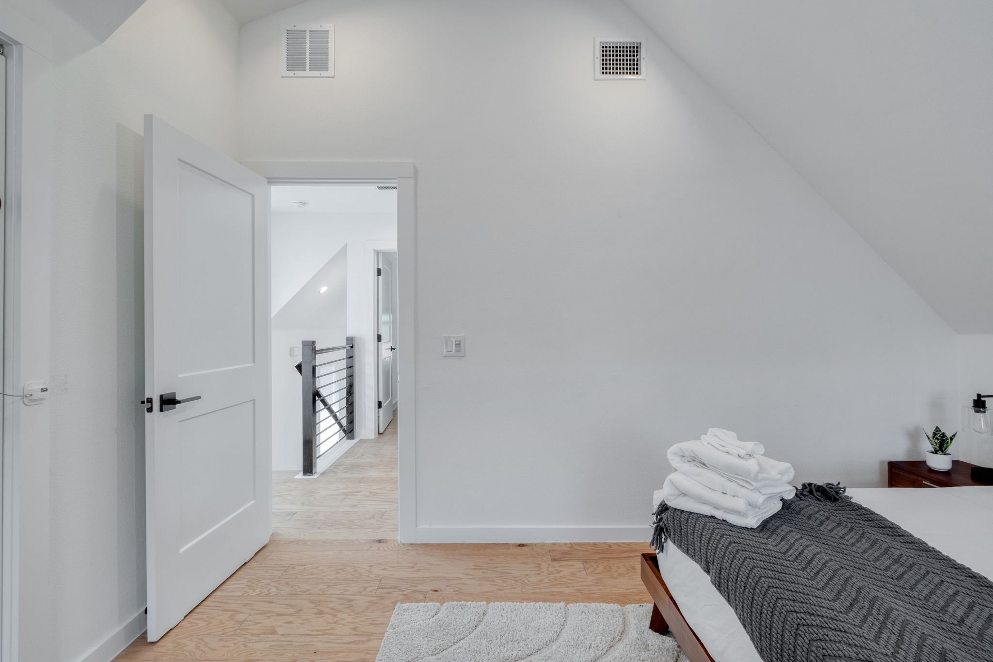 5406 Downs Drive, Unit 2 Austin, TX 78721 - Photo 15 of 24 a bedroom with a bed and glass door