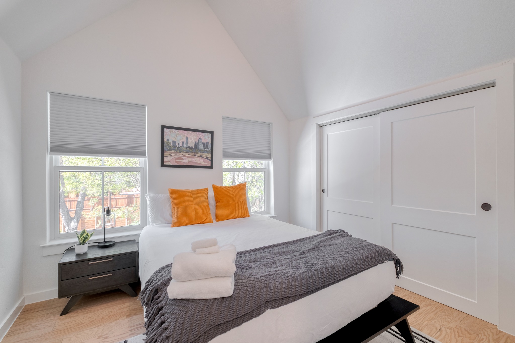 5406 Downs Drive, Unit 2 Austin, TX 78721 - Photo 16 of 24 a bedroom with a bed and couch